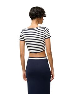 Discover the casual and elegant Guard Top. This fitted crop top features a bold striped pattern. It's the perfect addition to your wardrobe. Pair with the Karina Skirt! Fitted Horizontal Stripe Spring Top, Chic Fitted Vertical Stripes Tops, Striped Fitted Cropped Top, Fitted Striped Cropped Top, Chic Fitted Top With Vertical Stripes, Chic Fitted Tops With Vertical Stripes, Chic Striped Cropped Top, Chic Striped Cropped Crop Top, Casual Spring Tops By Staud