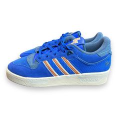 Step Up Your Sneaker Game With These Adidas Rivalry 86 Shoes In A Stylish Blue Colorway. The Low Top Design And Standard Shoe Width Make These Sneakers Perfect For Any Athletic Activity, Including Skateboarding. With Rubber Upper And Insole Material, You Can Be Sure Of The Durability And Comfort Of These Shoes. The Adidas 86 Product Line Is Known For Its Colorful And Trendy Designs, And These Shoes Are No Exception. Featuring A Unique Style Code Id4755 And Character Details In Blue, These Shoes Blue Adidas Custom Sneakers For Streetwear, Blue Skate Shoes With Laces For Sports, Blue Sports Skate Shoes, Blue Skate Shoes For Sports, Blue Mid-top Skate Shoes With Laces, Blue Mid-top Lace Skate Shoes, Adidas Blue Mid-top Sneakers, Adidas Blue Lace-up Skate Shoes, Blue Adidas Lace-up Skate Shoes