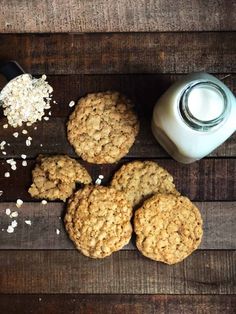 oatmeal cookies and milk on a wooden table