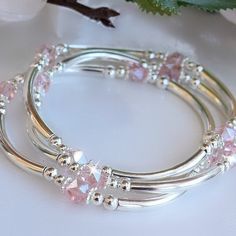 Set of three bangles is made with silver bars and pink crystals. Custom orders and sizes  This set of three stretch bracelets make a perfect gift for any occasion.  They are made with Pink European crystals and silver plated.  Each stretch band has a dainty crystal in the center, sparkling and reflecting light. Bracelets Silver, The Bangles, Bracelet Wedding, Swarovski Crystal Bracelet, Crystal Bangle, Bangles Jewelry Designs, Bracelet Crystal, Gold Bangles Design, Fancy Jewellery