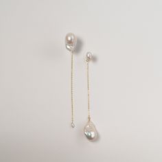 These Baroque Pearl drop earrings are perfect for those who love asymmetric designs, with the Yin Yang concept representing balance and harmony. The pearls are carefully selected for their quality, ensuring that each earring is one-of-a-kind. Wear these earrings to add a touch of elegance to any outfit, whether it's a formal wedding or a night out with friends. They also make a great gift for that special someone in your life who loves unique and beautiful jewelry. ---------------------------- Pearls: Baroque Pearls + Keshi Pearls Dimension: 14cm long, large pearls width approx 14+mm, small keshi pearls about 6mm Metal: Gold-filled chains 🤍 THE BEST VALUE BAROQUE PEARLS 🤍 Our close connections with freshwater oyster farms allow us to source pearls DIRECTLY from the framers. That's how we Luxury Handmade Dangle Pearl Earrings, Fine Jewelry Long Drop Linear Earrings For Wedding, Fine Jewelry Single Linear Earring For Wedding, Yellow Gold Drop Linear Earrings For Wedding, Asymmetry Design, Pearls Wedding, Beads Craft Jewelry, Beads Craft, Pearl Earrings Wedding