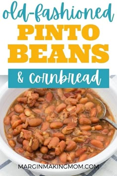 a white bowl filled with pinto beans and cornbread next to a blue checkered table cloth