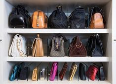 the purses are lined up on the shelves