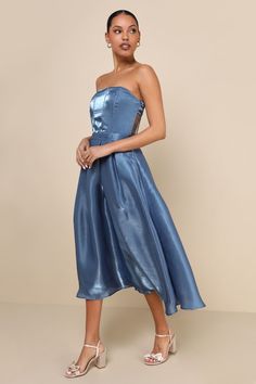 If you're aiming to stun, you'll always make the right choice when you wear the Lulus Radiant Direction Slate Blue Strapless Midi Dress With Pockets! Lightweight woven organza, with a luxe sheen throughout, shapes a strapless, corset-inspired bodice with a subtle sweetheart neckline, no-slip strips, hidden supportive boning, seaming details, and stunning sheer panels at the back. Banded waist tops a flaring skirt with side seam pockets, box pleats, and hidden tulle for volume, finishing at a mid Strapless Blue Midi Dress For Day Out, Strapless Blue Corset Dress, Chic Blue Strapless Corset Dress, Luxury Blue Strapless Midi Dress, Blue Strapless Dress With Pleated Bodice, Slate Blue Dress, Slate Blue Dresses, Organza Midi Dress, Strapless Organza