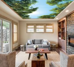 a living room with a ceiling that has a painting on the ceiling and couches