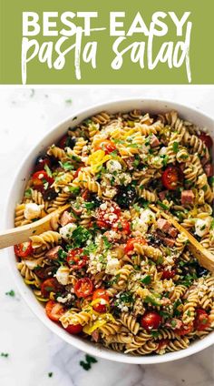 pasta salad in a white bowl with text overlay that reads best easy pasta salad