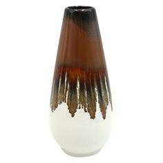 a brown and white vase sitting on top of a table