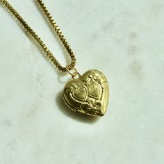 The necklace chain is a vintage solid brass box chain that is 16" in length with a functioning heart locket that is 0.79" x 0.9" in size.Please note the metal components are raw brass and as such, it is best to avoid humid environments or water exposure which can cause the brass to tarnish. There are brass cleaners available that assist with restoring the natural finish. Gold Brass Locket Necklace For Anniversary, Gold Heart Necklace With Box Chain, Brass Heart Charm Necklace Perfect For Gifts, Gold Heart Necklace Nickel Free, Gold Brass Locket Necklace As Gift, Gold Metal Locket Necklace For Anniversary, Gold Brass Locket Necklace Nickel Free, Nickel Free Gold Pendant Locket Necklace, Gold Pendant Locket Necklace Nickel Free