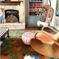 a living room filled with furniture and a fire place