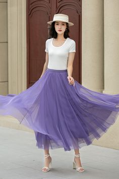 "Step into sunshine with our Women's Purple Beach Tulle Skirt. This Boho Tulle midi skirt and big swing chiffon skirt is a summer must-have. Whether you dress it up for a night out or keep it casual with sandals, this skirt is sure to become a go-to in your wardrobe. DETAILS: * Tulle Skirt * No Pockets * Polyester lining * Around elastic waistband * Circle Skirt * Big swing skirt * Mid-length skirt * A-line skirt * Perfect for spring, summer * Suit vacation, beach, dance etc. * Machine Washable in Warm/Cold Water; Do not bleach / Mid-iron / Hang Dry *More color https://etsy.me/3Uclegk CUSTOM MADE SERVICE If you * Change other color * Can't find your size in our size Chart * Change the Style * Change the length * Your Height is not Between 5'1\" - 5\"9\" * Your weight is not Between 47 kg - Summer Long Tulle Pleated Skirt, Summer Flowy Tulle Pleated Skirt, Purple Non-stretch Skirt For Spring, Spring Non-stretch Purple Skirt, Non-stretch Purple Skirt For Spring, Purple Tulle Flowy Skirt, Spring Full-length Flowy Skirt, Full Length Flowy Skirt For Spring, Purple Relaxed Summer Skirt