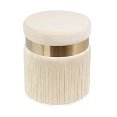 a white and gold container with fringes on the lid, isolated against a white background