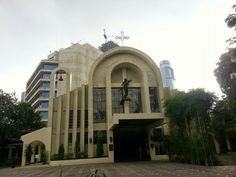 a large building with a clock on the front