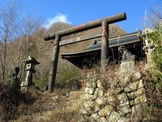 an old building sitting on top of a hill