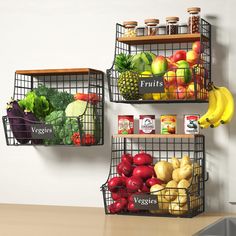 two metal baskets filled with fruits and vegetables