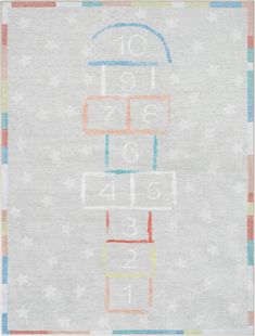 an area rug with numbers on it and stars around the edges, in pastel colors