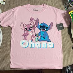 This Adorable Tee Shirt Features Experiment 626 And Experiment 624 Aka Stitch And Angel From Disney’s Lilo And Stitch Along With Scrump Underneath It Says Ohana Check Out My Other Lilo And Stitch Stuff To Bundle! Any Questions Please Ask! Pink Cute Shirt With Character Print, Cute Pink Shirt With Character Print, Pink Cartoon Print Short Sleeve Tops, Pink Short Sleeve Tops With Cartoon Print, Pink Short Sleeve Tops With Character Print, Short Sleeve Pink Tops With Character Print, Fun Pink Shirt With Cartoon Print, Cute Pink Short Sleeve Shirt, Pink Short Sleeve Shirt With Cartoon Print