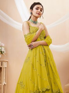 Introducing our adorable neon yellow sequins georgette wedding wear lehenga choli, a vibrant and stylish outfit that is perfect for any special occasion. This exquisite piece is made from high-quality georgette material in a stunning neon yellow color. It features intricate dori work, glitter sequin work, and embroidery work, adding a touch of elegance and glamour to the ensemble.
The set includes a matching georgette choli that is adorned with the same dori work, glitter sequin work, and embroi Dori Work, Georgette Material, Yellow Lehenga, Party Wear Lehenga Choli, Party Wear Lehenga, Designer Lehenga Choli, Green Sequins, Stylish Outfit, Sequins Embroidery