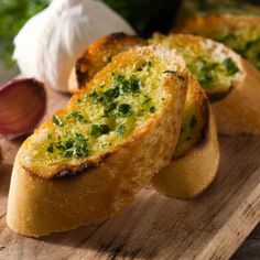 garlic bread with herbs and garlic on a cutting board