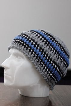 "Always struggle to find a birthday, or Christmas gift for that man in your life? Whether it be your dad, uncle, brother, son, or hubby...they are all a little hard to shop for. Here is a unique beanie he can appreciate. And plus, he will think of you everytime he puts it on to go outdoors in the cold weather. Feel free to message me for any special color requests. (Keep in mind this will take me a couple days to complete) Hat circumference Approx. 21\" Height 8\" They're cozy. They're breathable. They're each carefully crafted by me. 100% acrylic yarn Easy to care for, you can throw it in the washing machine and dryer with other laundry. I don't know about you, but I despise Winter. I really don't appreciate being cold. But putting on my favorite pair of boots and one of my handcrafted ha Unique Beanies, African Hats, Handmade Hats, Washing Machine And Dryer, Winter Hats For Men, Neck Accessories, Go Outdoors, Handmade Hat, Winter Beanie