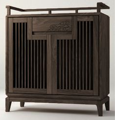 a wooden cabinet with carved designs on the front and sides, sitting against a white background