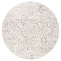 a round rug with an ornate design on the top and bottom, in beige tones