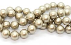 a strand of white pearls on a white background