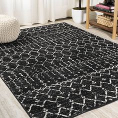 a black and white rug in a living room