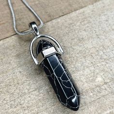 Black Howlite Crystal Pendant On 18" Silver Snake Chain. Other Chain Lengths Available, Please Message Before Purchasing For Other Options. Stone Measures Approx 1 3/8” Long. Shipped In Jewelry Box To Protect From Damage And For Easy Gifting. I Ship Daily! Thank You For Looking, I Appreciate Each And Every Customer And Order <3 #096 Nickel Free Black Pendant Necklace, Nickel-free Black Pendant Necklace, Black Nickel-free Pendant Necklace, Adjustable Black Metal Crystal Necklace, Black Wire Wrapped Pendant Crystal Necklaces, Black Wire Wrapped Crystal Pendant Necklace, Black Round Pendant With Lobster Clasp, Black Metal Crystal Necklaces As Gift, Black Pendant Necklaces With Lobster Clasp