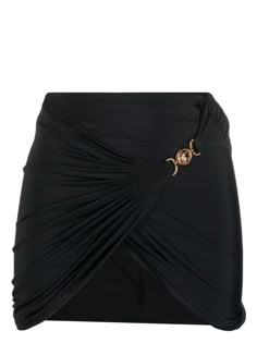 Medusa wrap skirt from Versace featuring black, stretch-design, gathered detailing, wrap design, Medusa Head motif, thigh-length and asymmetric design. Size Info STANDARD Color Detail Black Made In Italy Material Polyester 78% Elastane 22% Season One Fall-Winter Season Two Fall-Winter Product sea clothing Brand Versace Size And Fit This piece fits true to size. We recommend you get your regular sizeModel is 1,75m / 5ft 8in wearing size S Black Draped Bottoms For Evening, Evening Draped Skirt With Ruched Sides And Asymmetrical Shape, Evening Draped Asymmetrical Skirt With Ruched Sides, Stretch Draped Skirt For Night Out, Black Draped Ruched Bottoms, Black Ruched Draped Skirt, Black Draped Ruched Skirt, Ruched Draped Skirt For Night Out, Black Draped Bottoms For Night Out