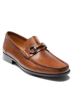 Magnanni's Blas II in Tabaco is a versatile bit loafer featuring a moc toe design and leather wrapped bit. The cushioned rubber sole offers all-day comfort and durability making it perfect for any dress or casual occasion. Handmade in Spain. This style is Special Order only. Please allow 5 business days to ship. Business Moc Toe Slip-ons, Business Casual Moc Toe Dress Shoes, Timeless Brown Moc Toe Moccasins, Moc Toe Bridle Leather Dress Shoes For Work, Bridle Leather Moc Toe Dress Shoes For Work, Timeless Moc Toe Dress Shoes In Bridle Leather, Timeless Moc Toe Moccasins For Business Casual, Timeless Moccasins With Rubber Sole, Timeless Moc Toe Dress Shoes With Stitched Sole