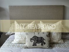 a bed with four pillows on it and the words diy headboard