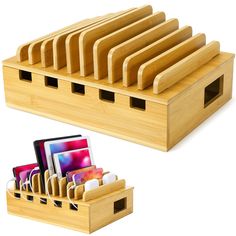 a wooden holder with cell phones in it and an iphone charging station attached to it