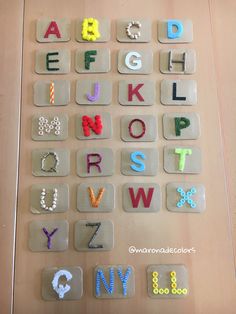 the letters are made out of plastic beads