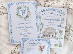 the wedding stationery is decorated with blue and white flowers, greenery, and an ornate monogrammed design