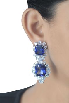 This breath-taking piece is all crafted from sapphire & CZ's. It is wonderfully presented by the sapphire which is beautifully surrounded by the white CZ's of exquisite quality. Try wearing them with your hair pulled back in a sleek ponytail or a bun for a dramatic look. About the Product: Metal: Solid 925 Sterling Silver Stones: Cubic Zirconia Grade: AAAAA Cut: Excellent Clarity: Excellent Why Buy from Adastra? 1. The USA patented 925 Sterling Silver, making each creation last for decades. 2. E Luxury Diamond Gemstone Earrings For Party, Formal Fusion Bridal Earrings With Cubic Zirconia, Luxury Gemstone Bridal Earrings For Party, Party Fine Jewelry Cluster Earrings In Cubic Zirconia, Party Fine Jewelry Cluster Earrings With Cubic Zirconia, Sapphire Earrings With Brilliant Cut For Evening, Brilliant Cut Sapphire Earrings For Evening, Dazzling Brilliant Cut Earrings For Party, Evening Sapphire Earrings With Brilliant Cut