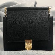 "Brand New With Dust Bag. Never Used. Dimensions: 17 X 16.5 X 10 Cm. Weight: 430 G. Chain Length: 107 Cm. Interior Pocket. Luxe Black Shoulder Bag For Everyday Use, Elegant Everyday Bags With Branded Hardware, Black Timeless Shoulder Bag For Everyday Luxury, Black Formal Shoulder Bag With Chain Strap, Black Luxe Bag For Formal Occasions, Formal Black Shoulder Bag With Chain Strap, Chic Formal Bag With Branded Hardware, Chic Formal Bags With Branded Hardware, Chic Evening Shoulder Bag With Branded Hardware