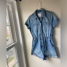 Button Up Denim Romper Never Worn - Was Going To Wear To A Country Concert But Didn’t Casual Light Wash Denim Jumpsuit With Button Closure, Casual Denim Jumpsuit With Buttons, Casual Light Wash Denim Jumpsuit, Casual Short Sleeve Denim Jumpsuit With Buttons, Casual Blue Denim Jumpsuit With Button Closure, High Rise Casual Denim Jumpsuit With Button Closure, Casual High Rise Denim Jumpsuit With Button Closure, Casual High Rise Denim Jumpsuit With Buttons, Casual High-rise Denim Jumpsuit With Button Closure