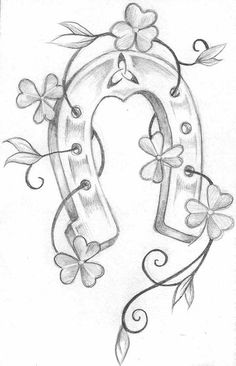 the letter q with flowers and leaves on it is drawn in pencil by hand,