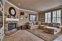 a living room with couches and a fireplace