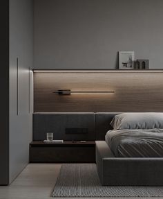 a bedroom with a bed, night stand and nightstands on either side of the bed