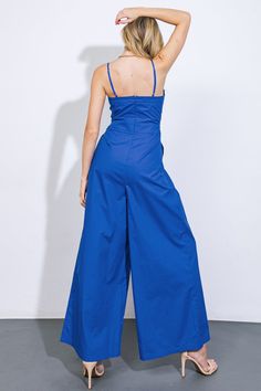 A solid woven jumpsuit featuring scalloped bodice edge, shoulder strap, button down, pleated front pant, wide leg and back zipper closureDetails:Self : 100% CottonSize & Fit- Model is 5`8" And Wearing Size Small- Measurements Taken From Size Small- Approx. Length: 60" Fitted Wide Leg Jumpsuit Or Romper In Solid Color, Chic Wide Leg Overalls For Work, Spring Strapless Jumpsuit With Pockets, Spring High-waist Jumpsuits And Rompers, Spring Strapless Wide Leg Jumpsuit, Summer Party Cotton Jumpsuits And Rompers, Cotton Strapless Jumpsuit With Pockets For Spring, Cotton Jumpsuits And Rompers For Summer Party, Solid Color Summer Jumpsuits And Rompers With Wide-leg Pants