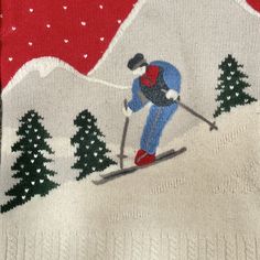 an ugly sweater with a skier on it