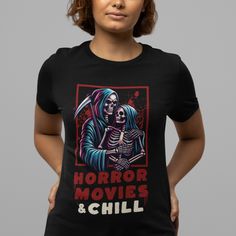 Introducing the must-have for enthusiasts who appreciate both style and durability - our "Horror Movies and Chill" unisex tee. Crafted from a lightweight blend of 100% Airlume combed and ringspun cotton, this shirt is not only exceptionally soft but also built to withstand the test of time without losing its shape. The ribbed knit collar enhances sizing, and the dual side seams guarantee consistent sizing for your ultimate comfort. Enjoy the perfect fit with our retail cut and the convenience of a tear-away label. Embrace the true-to-size fit and elevate your casual wardrobe with this stylish tee. Black Top With Sublimation Print In Ring-spun Cotton, Black Cotton Horror T-shirt, Horror Graphic Print T-shirt For Fans, Black Ring-spun Cotton T-shirt With Sublimation Print, Horror Fan Merchandise T-shirt With Screen Print, Pre-shrunk Horror T-shirt For Streetwear, Horror Movies And Chill, The Test, Unisex Shorts