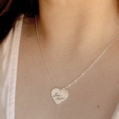 Personalize this item with your own sentimental handwriting, art and messages. 3/4 x 3/4 Inch Heart Pendant Satin Brushed - Sterling Silver 16 Inch Sterling Cable Chain (With 2 Inch Extender) The Everleigh Necklace features forgiving sizing. The chain can be clasped at any length between 16 - 18 inches. 6 WORD LIMIT PER SIDE CUSTOMIZE YOUR ORDER The following will be engraved with the handwriting images you provide. Please type the exact phrasing and punctuation you would like used from your ima Engraved Sterling Silver Heart Pendant Necklace, Personalized White Gold Heart Necklace In Sterling Silver, Personalized Sterling Silver Heart Pendant Necklace, Personalized Sterling Silver Heart Necklace For Memorial, Mother's Day Sterling Silver 925 Stamped Heart Necklace, Valentine's Day Engraved Sterling Silver Heart Necklace, Stamped Sterling Silver Heart Pendant Necklace, Personalized Heart Pendant Necklace In Sterling Silver, Personalized Sterling Silver Heart Necklace With Round Pendant