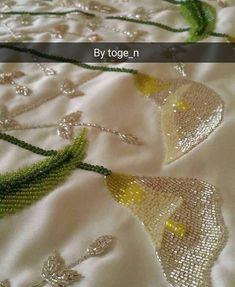 the beading is being worked on by toge n