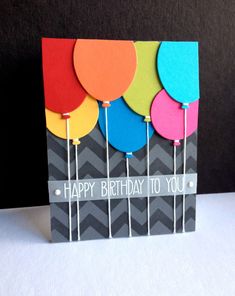 a birthday card with colorful balloons on it