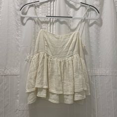 Urban Outfitters Cream Ruffle Top - New Without Tags - Stretchy Straps And Stretchy Back - Perfect To Dress Up Or Dress Down For The Summer Chic Cream Tops By Urban Outfitters, Casual Ruffled Tops From Urban Outfitters, Fitted Urban Outfitters Tops With Ruffles, Urban Outfitters Sleeveless Cotton Top, Urban Outfitters Ruffled Vacation Dress, Urban Outfitters Tops, Ruffle Top, Dressed Down, Urban Outfitters