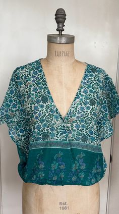 Printed Crop Top With Short Sleeves Color: Emerald Size: One Size, Fits Size 2 to 10 100% Indian Cotton Made in India Cotton V-neck Beachwear Tops, Green V-neck Tops For Festival, Green V-neck Hippie Top, Green Cotton V-neck Blouse, Turquoise Floral Print Tops For Beach, Green V-neck Top For Vacation, Summer Cotton Tops With Boho Print, Cotton Boho Print Summer Tops, Green V-neck Top For Beach