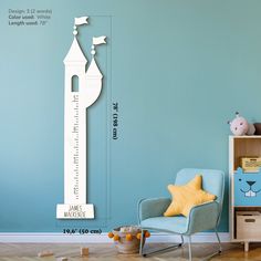 a child's room with a blue wall and white height chart