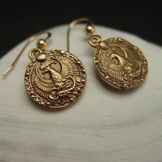 Handmade antiqued dainty birthday gift Scorpio earrings. This charm has the phoenix protecting the Scorpio.Handmade antiqued bronze coin charm with the zodiac sign of Scorpio for people born between October 24 to November 22.Scorpio are: Resourceful, Brave, Passionate, Stubborn, True Friend.The concept of the zodiac originated in Babylonian astrology, and was later influenced by Hellenistic culture. According to astrology, celestial phenomena relate to human activity on the principle of "as abov Symbolic Antique Gold Medallion Jewelry, Symbolic Bronze Jewelry With Antique Finish, Bronze Symbolic Jewelry With Antique Finish, Symbolic Antique Bronze Jewelry, Symbolic Antique Finish Bronze Jewelry, Ancient Style Oxidized Jewelry Gift, Ancient Style Oxidized Jewelry As Gift, Ancient Style Oxidized Jewelry For Gift, Gold Earrings With Antique Finish For Gift